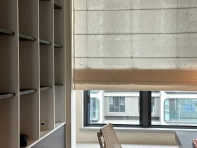 Roman blinds gathered in soft folds