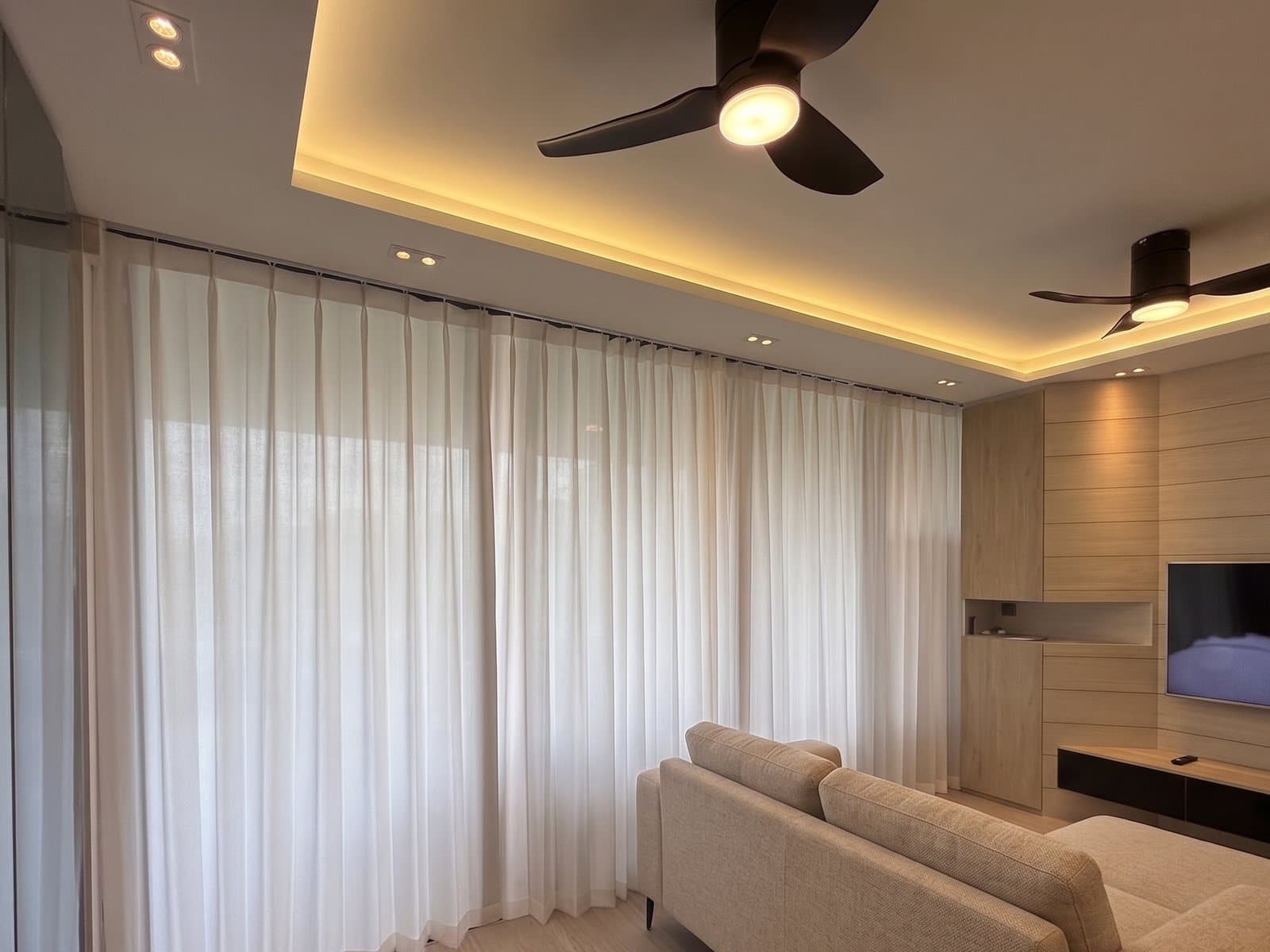 Sheer curtains filtering daylight in a living room