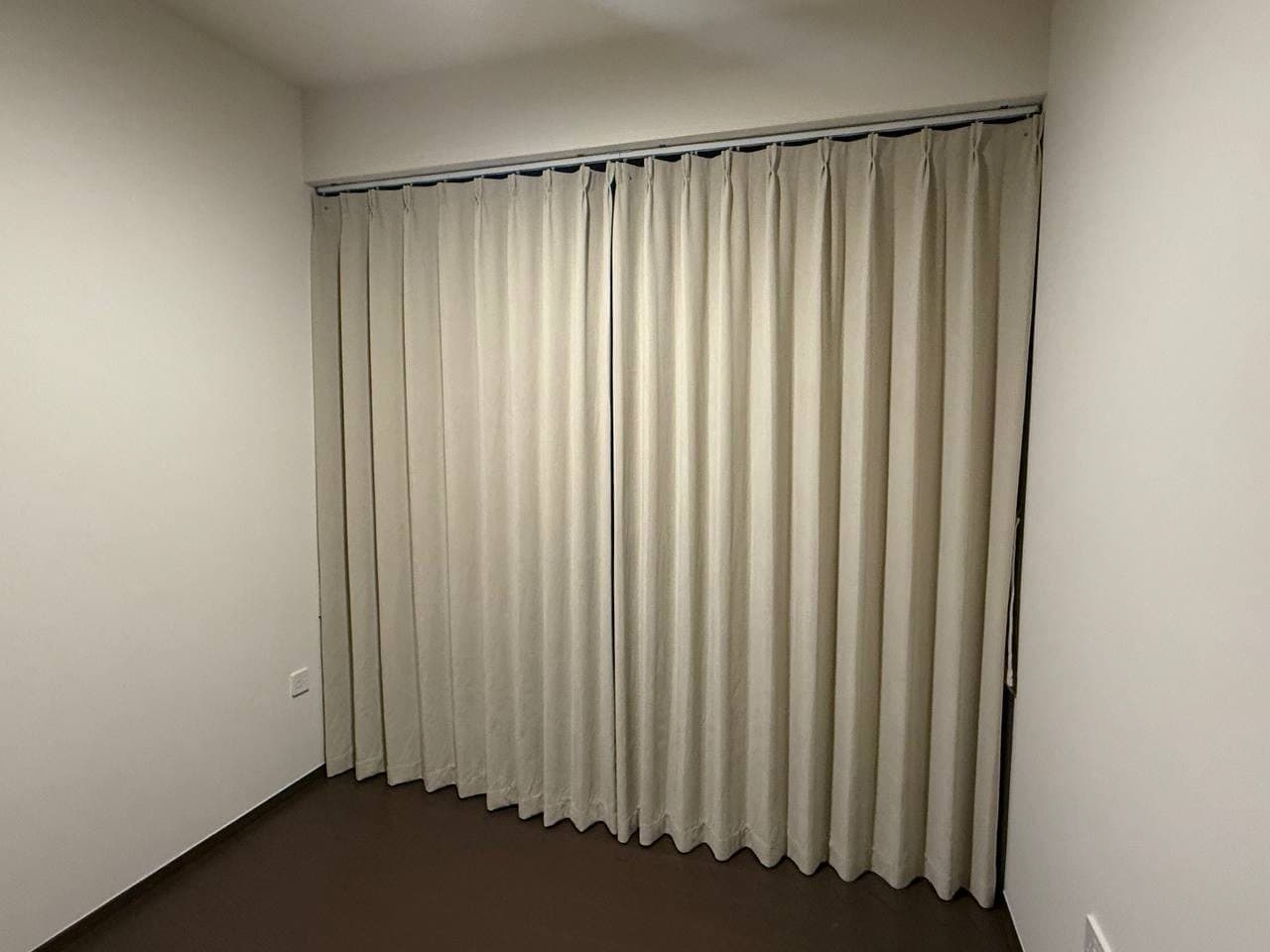 Night curtains drawn across a bedroom window