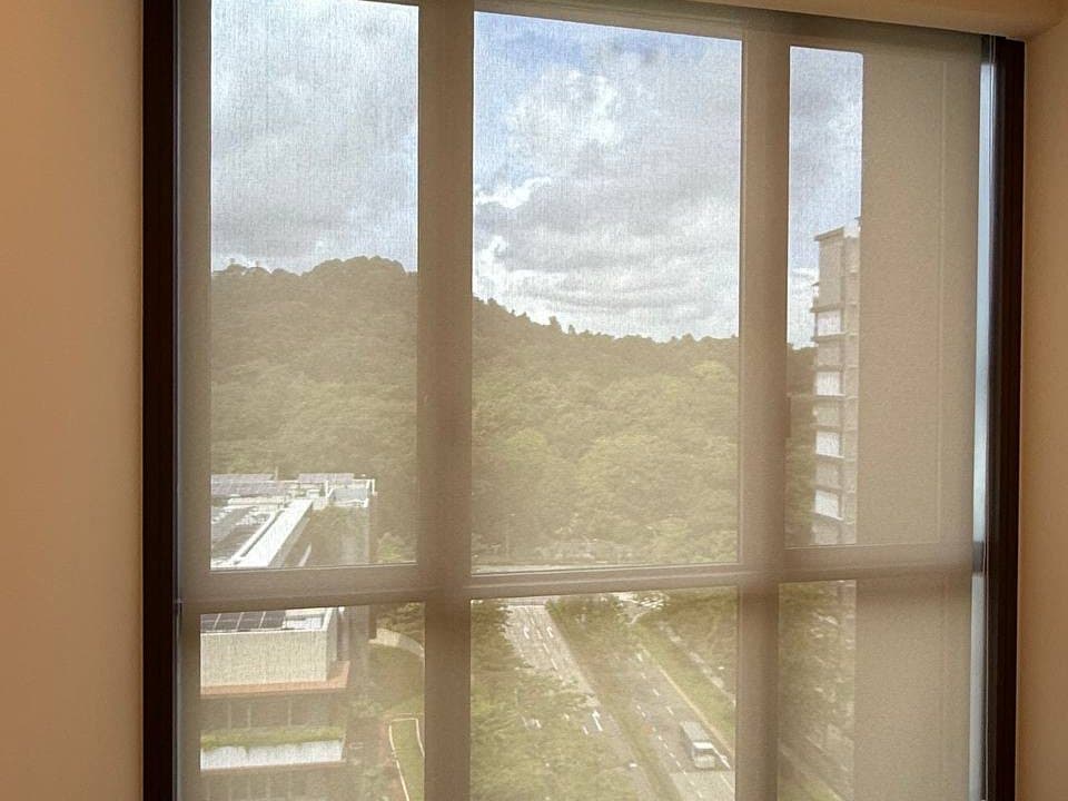 Roller blinds on a bright Singapore window